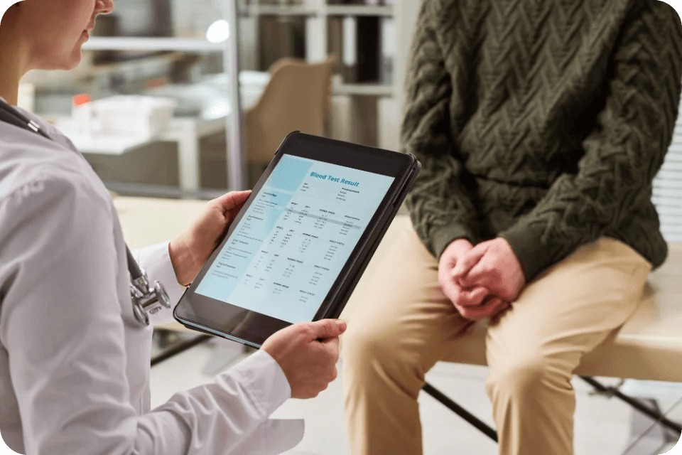 A provider and a member looking at a tablet